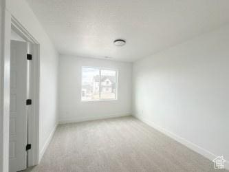 5644 W 7340 S, West Jordan, UT 84081 - carpeted empty room featuring baseboards