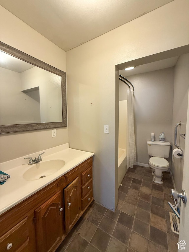 2427 E Main St, Wellington, UT 84542 - full bathroom with vanity, tile patterned flooring, visible vents, toilet, and shower / bath combo with shower curtain