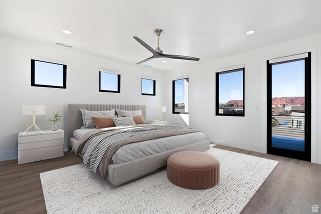 1461 W Canyon Tree Dr, St George, UT 84770 - bedroom with access to outside, dark wood-style flooring, multiple windows, and recessed lighting