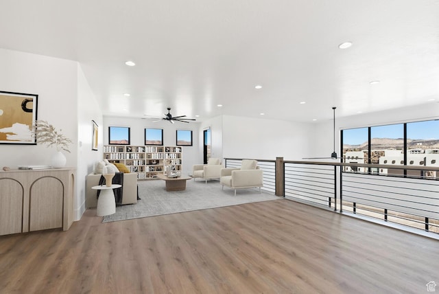 1461 W Canyon Tree Dr, St George, UT 84770 - unfurnished living room featuring wood finished floors, a ceiling fan, and recessed lighting