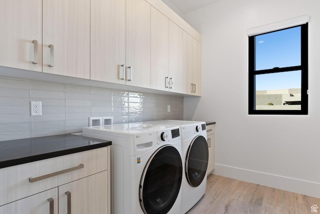 1461 W Canyon Tree Dr, St George, UT 84770 - laundry area featuring cabinet space, light wood-style flooring, baseboards, and separate washer and dryer