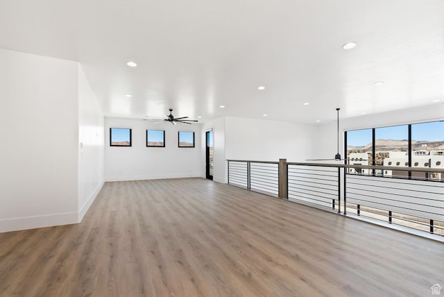 1461 W Canyon Tree Dr, St George, UT 84770 - spare room with ceiling fan, baseboards, wood finished floors, and recessed lighting