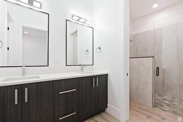 1461 W Canyon Tree Dr, St George, UT 84770 - full bath with double vanity, a shower stall, a sink, and wood finished floors