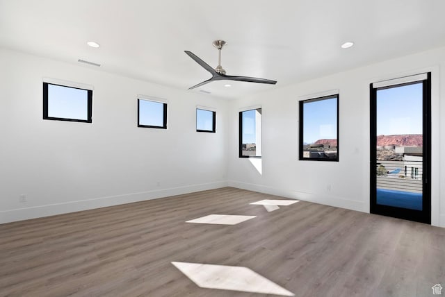 1461 W Canyon Tree Dr, St George, UT 84770 - unfurnished room featuring light wood-style flooring, baseboards, a ceiling fan, and recessed lighting