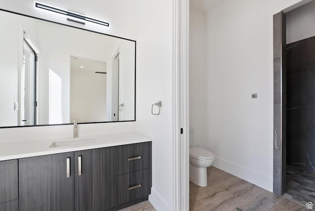 1461 W Canyon Tree Dr, St George, UT 84770 - full bathroom featuring toilet, wood finished floors, visible vents, vanity, and baseboards