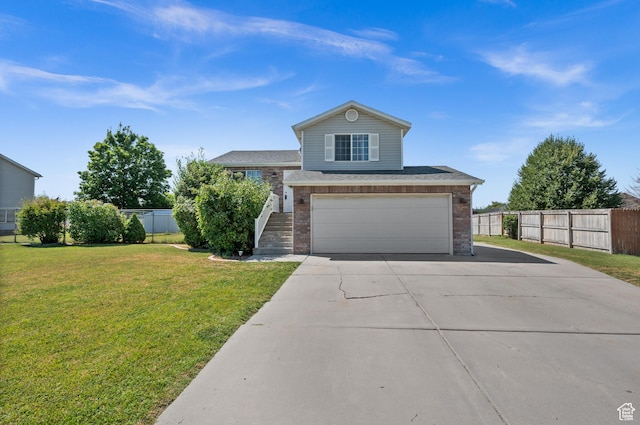 2337 W 2075 N, Clinton, UT 84015 - view of front of property featuring concrete driveway, brick siding, and an attached garage