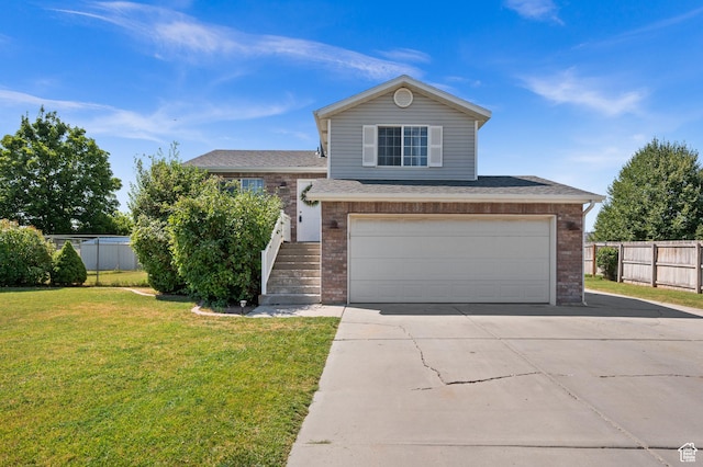 2337 W 2075 N, Clinton, UT 84015 - view of front facade featuring driveway, a garage, brick siding, and roof with shingles