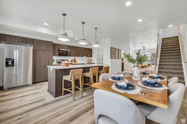 239 E Burch Creek Pl S, Ogden, UT 84405 - dining space featuring stairs, light wood-style flooring, and recessed lighting