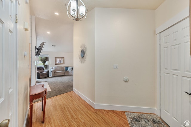 foyer with light wood-style flooring, visible vents, baseboards, and recessed lighting