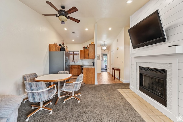 dining space featuring visible vents, light colored carpet, a tile fireplace, ceiling fan, and recessed lighting