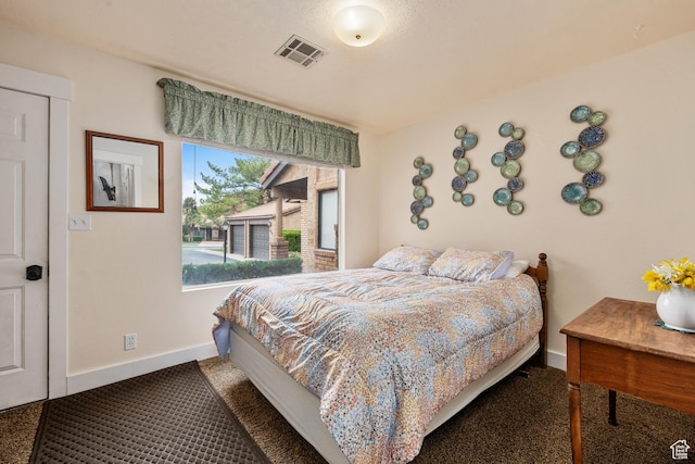bedroom with visible vents and baseboards
