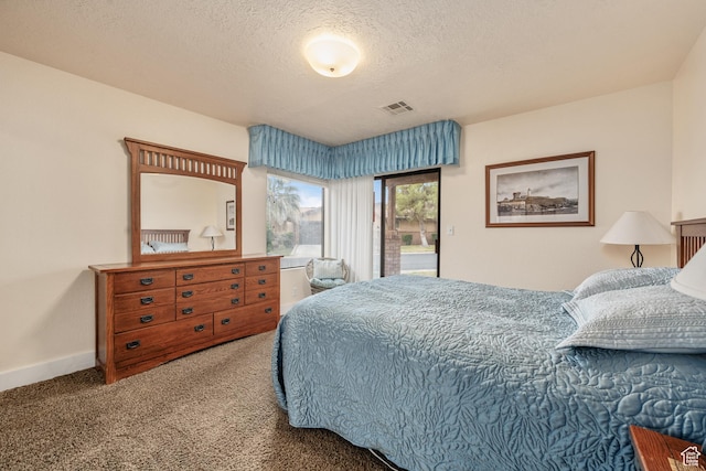 bedroom featuring baseboards, visible vents, access to exterior, a textured ceiling, and carpet floors