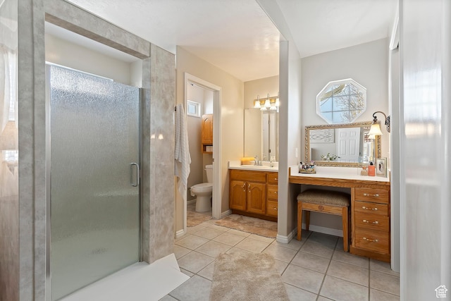 333 S Park St, Grantsville, UT 84029 - bathroom with toilet, a stall shower, vanity, tile patterned flooring, and baseboards