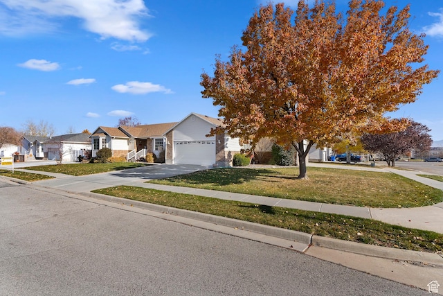 333 S Park St, Grantsville, UT 84029 - obstructed view of property with a residential view, concrete driveway, an attached garage, and a front lawn