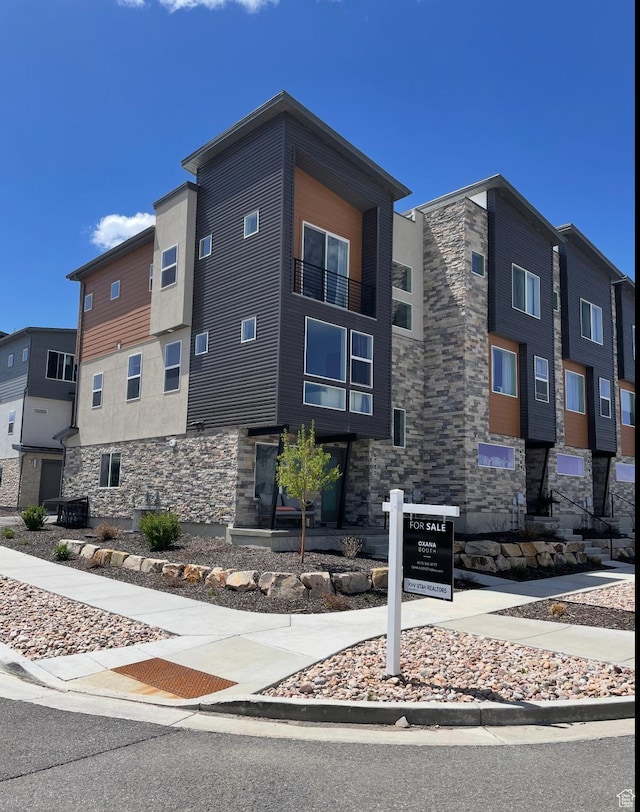 6785 Silver Creek Dr N, Park City, UT 84098 - view of front facade with stone siding and central air condition unit