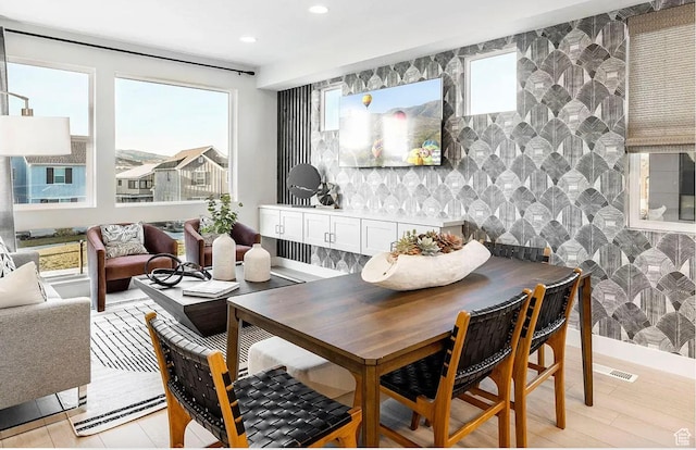 dining space featuring recessed lighting and visible vents