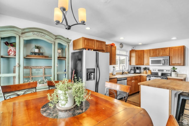 33841 N 7925 E, Fairview, UT 84629 - kitchen featuring wine cooler, wood counters, hanging light fixtures, stainless steel appliances, and a sink