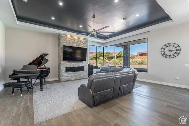 3052 N Snow Canyon Pkwy Unit 201, St George, UT 84770 - living room with baseboards, a raised ceiling, and wood finished floors