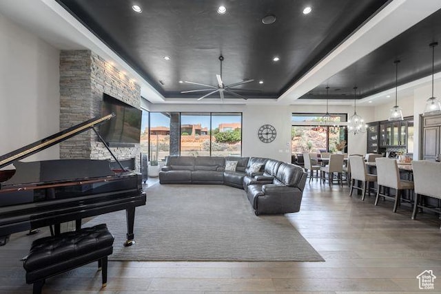 3052 N Snow Canyon Pkwy Unit 201, St George, UT 84770 - living room with an inviting chandelier, a raised ceiling, wood finished floors, and recessed lighting