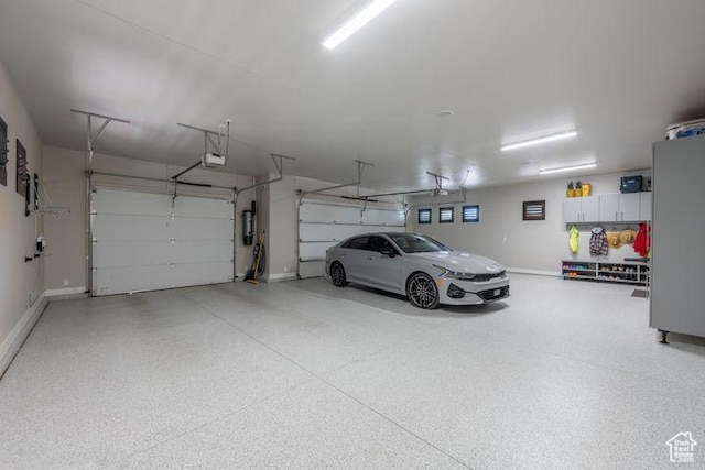 3052 N Snow Canyon Pkwy Unit 201, St George, UT 84770 - garage featuring a garage door opener and baseboards