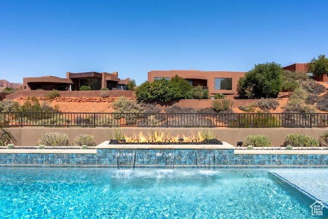3052 N Snow Canyon Pkwy Unit 201, St George, UT 84770 - view of swimming pool with a fenced in pool and fence