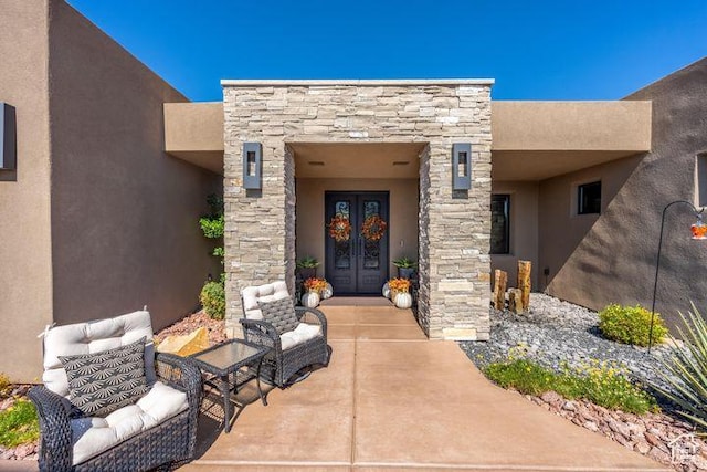 3052 N Snow Canyon Pkwy Unit 201, St George, UT 84770 - view of exterior entry with stone siding, stucco siding, and french doors
