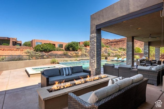 3052 N Snow Canyon Pkwy Unit 201, St George, UT 84770 - view of patio with an in ground hot tub, an outdoor living space with a fire pit, a fenced in pool, and fence