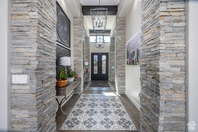 3052 N Snow Canyon Pkwy Unit 201, St George, UT 84770 - foyer entrance featuring a towering ceiling, dark wood-style flooring, a notable chandelier, and french doors
