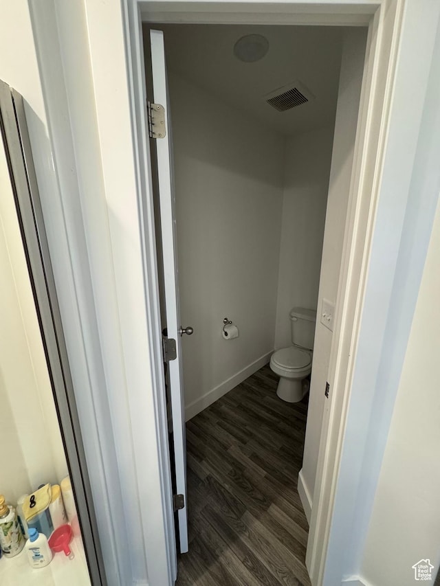 4834 E Hidden Steppe Bnd, Eagle Mountain, UT 84005 - bathroom with wood finished floors, visible vents, toilet, and baseboards
