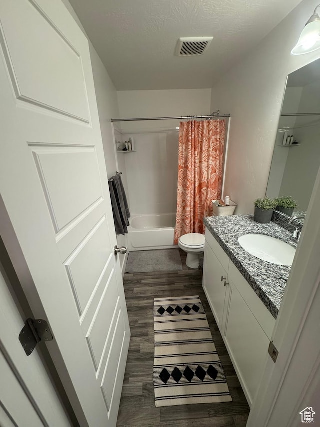 4834 E Hidden Steppe Bnd, Eagle Mountain, UT 84005 - bathroom featuring toilet, visible vents, shower / tub combo, wood finished floors, and vanity