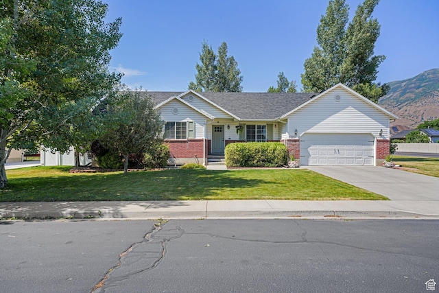 1320 W 1340 N, Pleasant Grove, UT 84062 - ranch-style house with an attached garage, brick siding, driveway, a front yard, and a mountain view