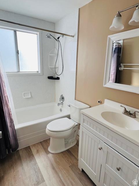 2299 W 5950 S, Roy, UT 84067 - full bathroom with shower / tub combo, wood finished floors, vanity, and toilet