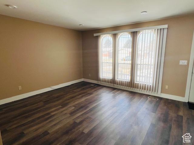 2299 W 5950 S, Roy, UT 84067 - empty room featuring baseboards and dark wood-style flooring