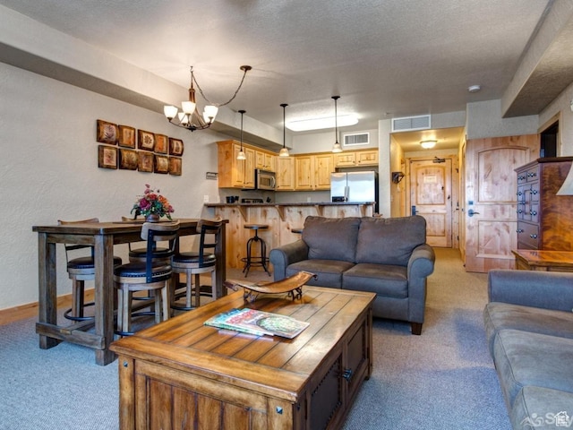 2653 W Canyons Resort Dr Unit 226, Park City, UT 84098 - carpeted living room with a chandelier, visible vents, a textured wall, and a textured ceiling