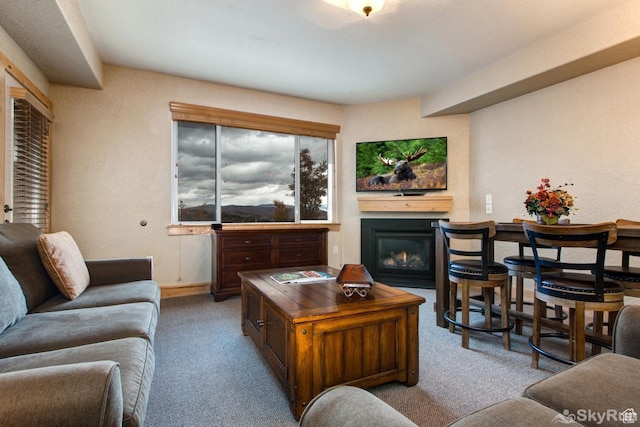 2653 W Canyons Resort Dr Unit 226, Park City, UT 84098 - living room with a textured wall, baseboards, carpet flooring, and a glass covered fireplace