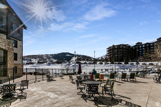 2653 W Canyons Resort Dr Unit 226, Park City, UT 84098 - snow covered patio with fence and a mountain view