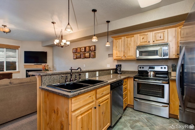2653 W Canyons Resort Dr Unit 226, Park City, UT 84098 - kitchen with decorative light fixtures, stainless steel appliances, open floor plan, a sink, and a peninsula