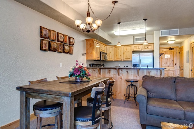 2653 W Canyons Resort Dr Unit 226, Park City, UT 84098 - kitchen with visible vents, appliances with stainless steel finishes, open floor plan, and a textured wall