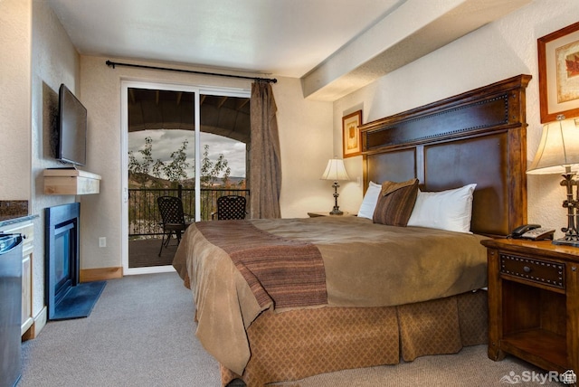 2653 W Canyons Resort Dr Unit 226, Park City, UT 84098 - carpeted bedroom featuring baseboards, a fireplace with flush hearth, and access to exterior