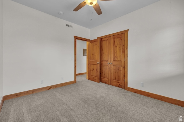 4988 S Timber Way E Unit 310, Salt Lake City, UT 84117 - unfurnished bedroom featuring visible vents, baseboards, a ceiling fan, and light colored carpet