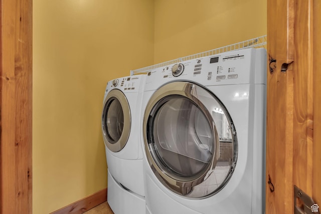 4988 S Timber Way E Unit 310, Salt Lake City, UT 84117 - laundry area with laundry area, separate washer and dryer, and baseboards