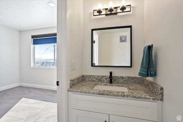 3543 N Creekside Way E Unit 63, Eden, UT 84310 - bathroom with visible vents, baseboards, a textured ceiling, and vanity