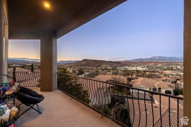 balcony featuring a residential view and a mountain view