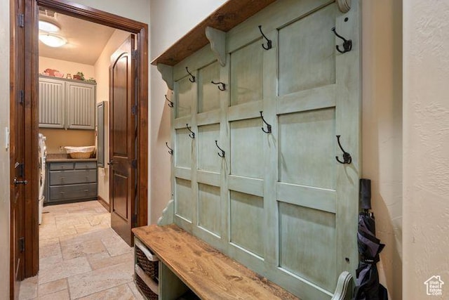 mudroom with stone tile flooring