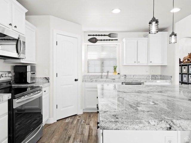 4863 N Shady Hollow Ln W, Lehi, UT 84043 - kitchen with a sink, appliances with stainless steel finishes, white cabinetry, wood finished floors, and light stone counters