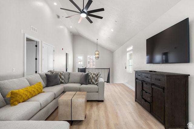 living room featuring visible vents, a ceiling fan, light wood-style flooring, high vaulted ceiling, and recessed lighting