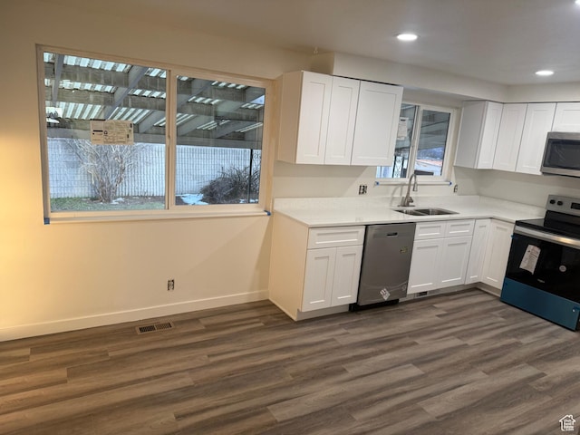 4129 S 3600 W, West Valley City, UT 84119 - kitchen with stainless steel appliances, light countertops, a sink, and white cabinetry