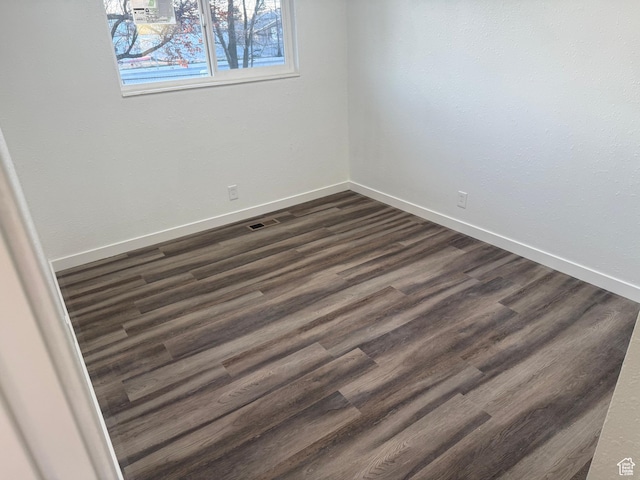 4129 S 3600 W, West Valley City, UT 84119 - empty room with dark wood-style floors, visible vents, and baseboards