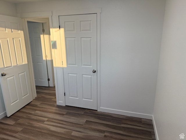4129 S 3600 W, West Valley City, UT 84119 - unfurnished bedroom featuring dark wood-type flooring and baseboards