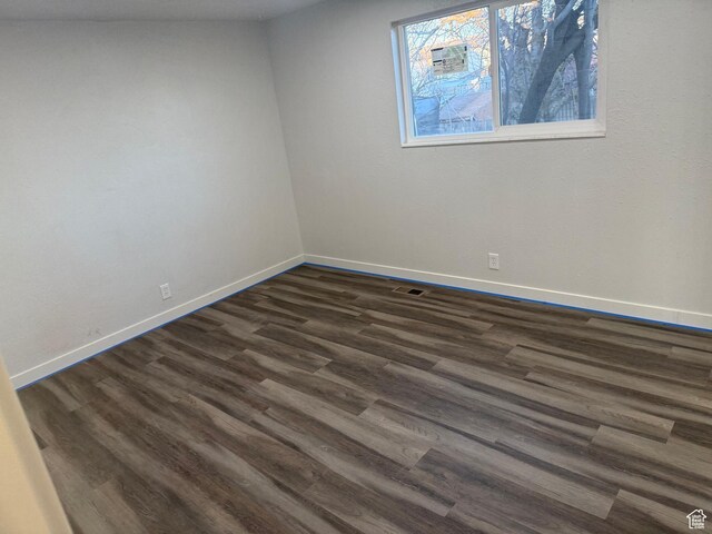 4129 S 3600 W, West Valley City, UT 84119 - spare room featuring visible vents, baseboards, and dark wood finished floors